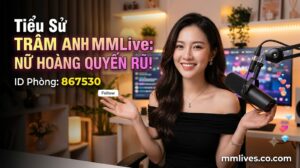 Banner hồ sơ idol Trâm Anh MMLive, giới thiệu 'Nữ hoàng quyến rũ!' với ID phòng 867530. Hình ảnh một nữ streamer trẻ mỉm cười trước thiết bị livestream, với các biểu tượng trái tim và kim cương bay lên. Bao gồm domain fencingchannel.tv.